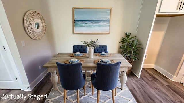 dining room with dark hardwood / wood-style flooring