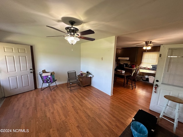 interior space featuring wood-type flooring and ceiling fan