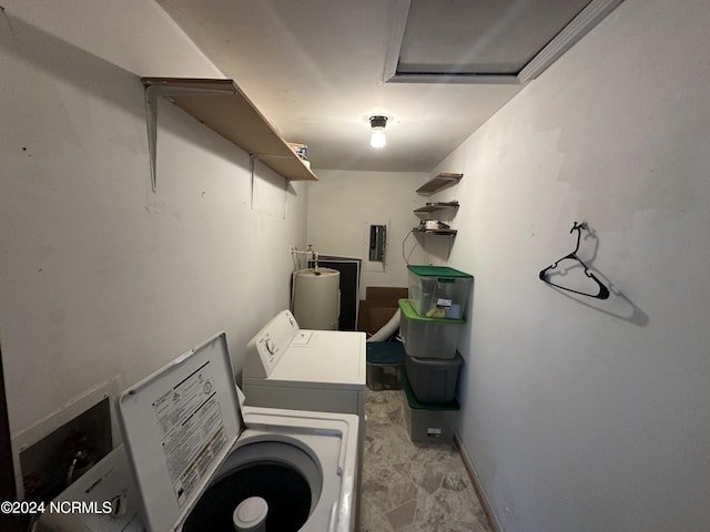 laundry room featuring laundry area, electric panel, washing machine and clothes dryer, and water heater