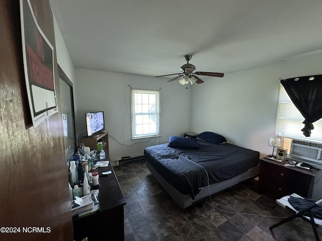 bedroom with cooling unit and a ceiling fan