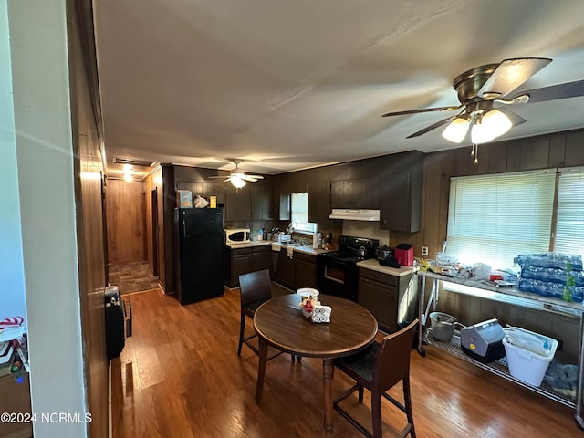 dining area with ceiling fan and hardwood / wood-style floors