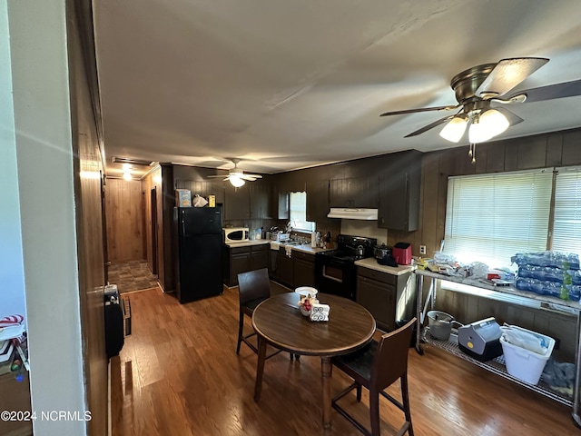 dining area with a ceiling fan and dark wood-style flooring