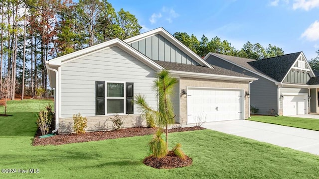 craftsman-style house featuring a garage and a front lawn