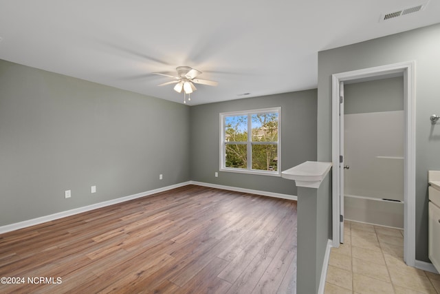 interior space featuring ceiling fan and light wood-type flooring