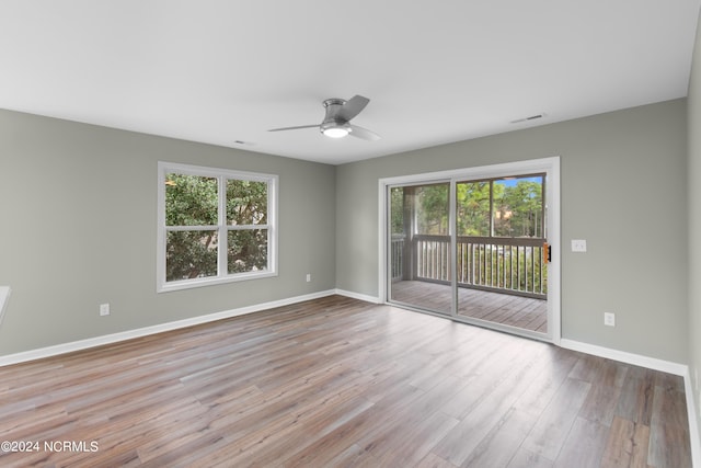 unfurnished room featuring ceiling fan and light hardwood / wood-style floors