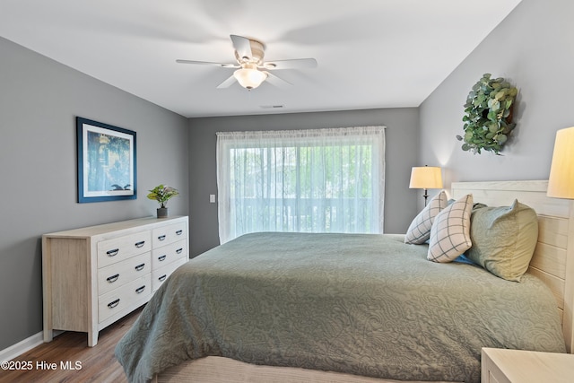 bedroom featuring dark wood-style floors, access to outside, ceiling fan, and baseboards