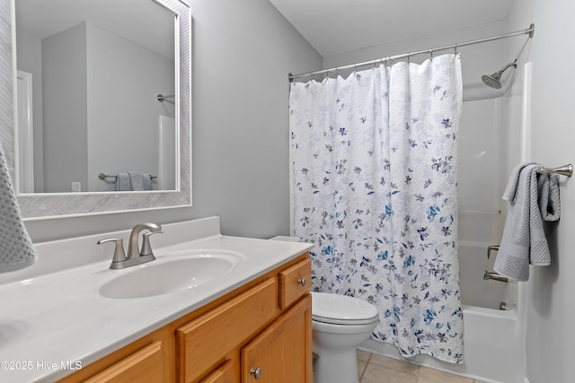full bathroom featuring tile patterned floors, toilet, vanity, and shower / bath combo