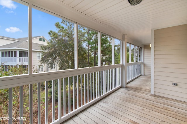 unfurnished sunroom with plenty of natural light