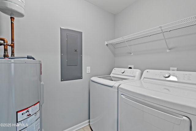 washroom with water heater, electric panel, separate washer and dryer, and baseboards