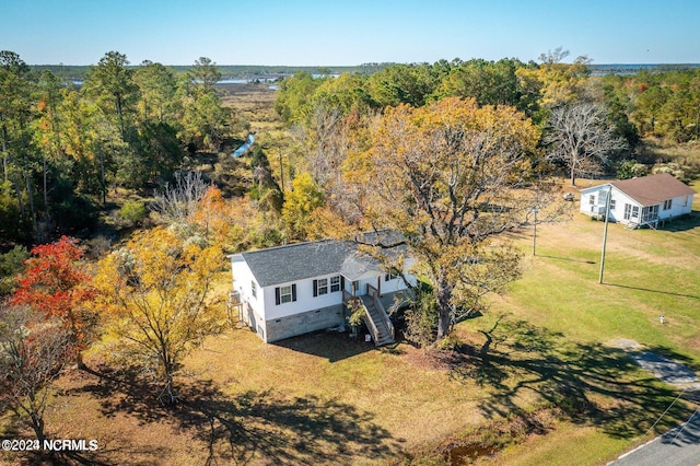 drone / aerial view with a view of trees