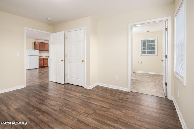 spare room featuring dark hardwood / wood-style floors