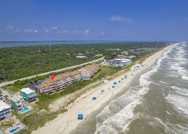 drone / aerial view featuring a water view and a beach view