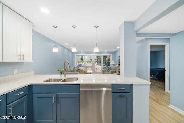 kitchen featuring kitchen peninsula, light hardwood / wood-style floors, stainless steel dishwasher, and white cabinets