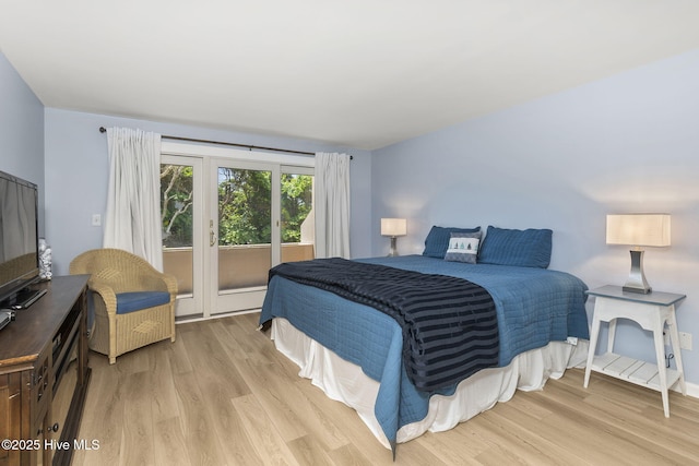 331 Salter Path Rd Unit 104, Pine Knoll Shores, NC 28512 - bedroom with light wood-style floors and access to outside