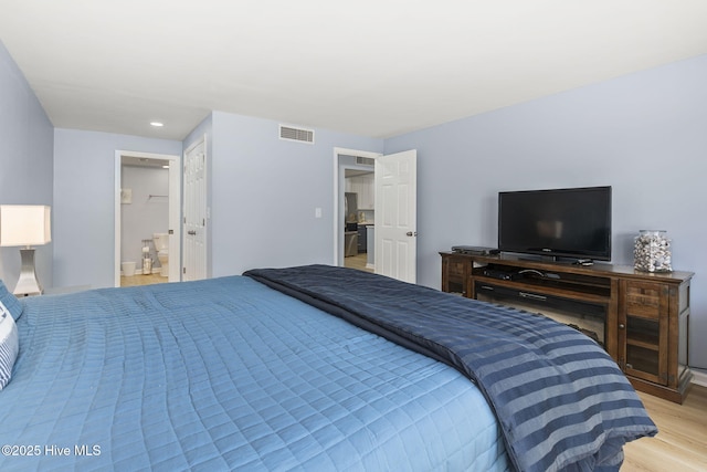 331 Salter Path Rd Unit 104, Pine Knoll Shores, NC 28512 - bedroom featuring light wood-type flooring, recessed lighting, and ensuite bathroom