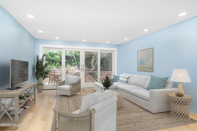 living room featuring french doors and light hardwood / wood-style floors