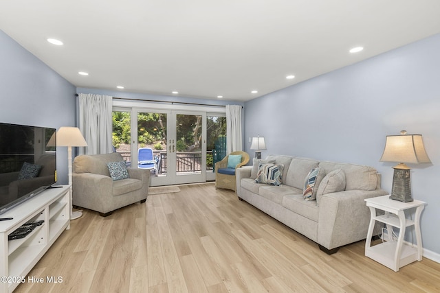 331 Salter Path Rd Unit 104, Pine Knoll Shores, NC 28512 - living room featuring light wood-type flooring, french doors, and recessed lighting