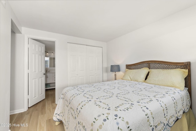 331 Salter Path Rd Unit 104, Pine Knoll Shores, NC 28512 - bedroom with wood finished floors, a closet, and baseboards