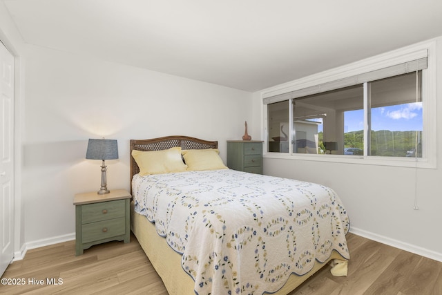 331 Salter Path Rd Unit 104, Pine Knoll Shores, NC 28512 - bedroom featuring wood finished floors and baseboards