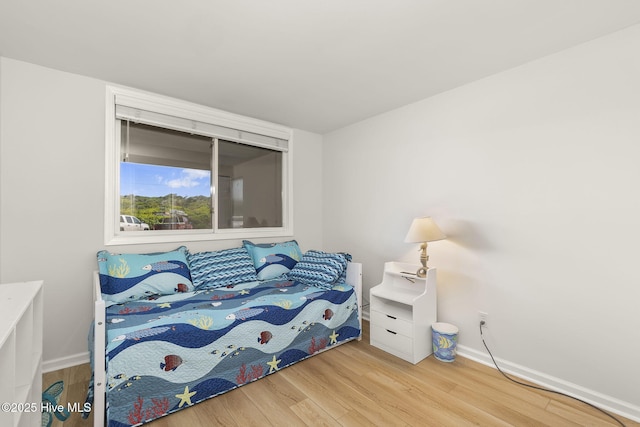 331 Salter Path Rd Unit 104, Pine Knoll Shores, NC 28512 - bedroom with wood finished floors and baseboards