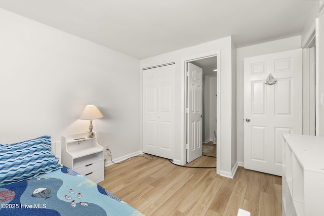 331 Salter Path Rd Unit 104, Pine Knoll Shores, NC 28512 - bedroom with light wood-type flooring, baseboards, and a closet