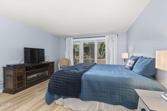331 Salter Path Rd Unit 104, Pine Knoll Shores, NC 28512 - bedroom featuring light wood-style flooring and access to outside