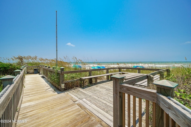 view of home's community featuring a view of the beach and a water view