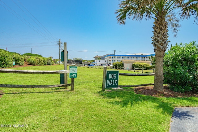 view of property's community with a lawn