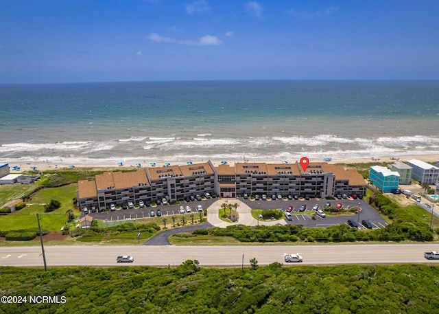 bird's eye view featuring a water view and a view of the beach