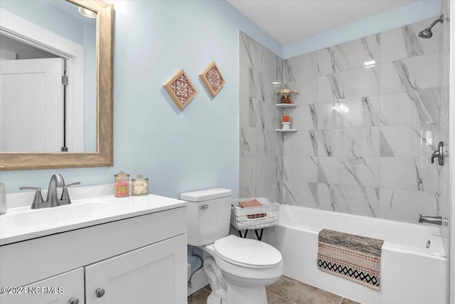 full bathroom featuring tile patterned floors, vanity, tiled shower / bath combo, a textured ceiling, and toilet