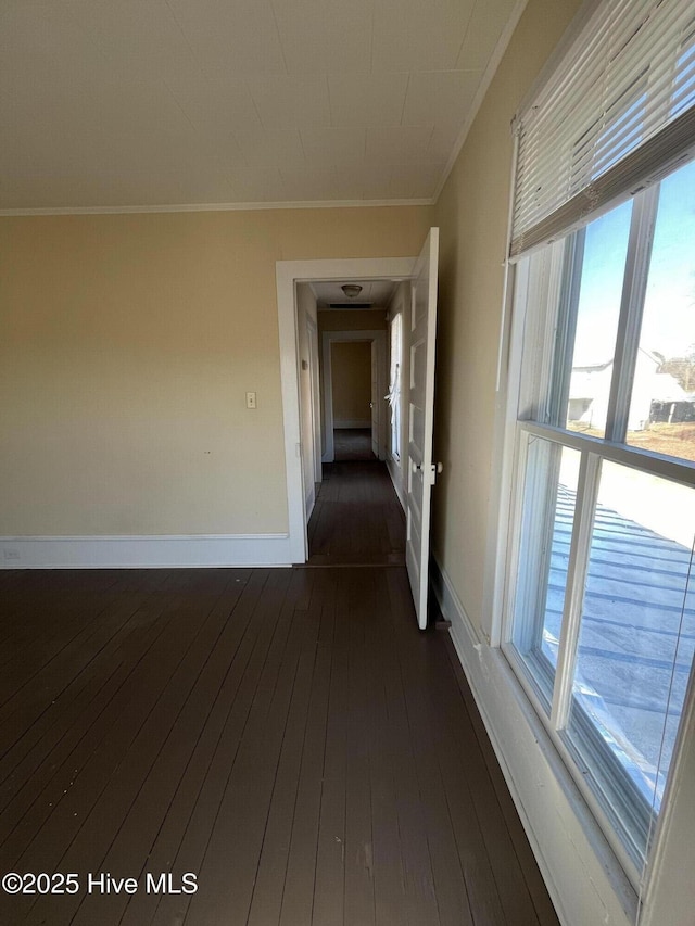 105 Hazel St, Woodland, NC 27897 - hall featuring a healthy amount of sunlight, crown molding, baseboards, and dark wood-style flooring