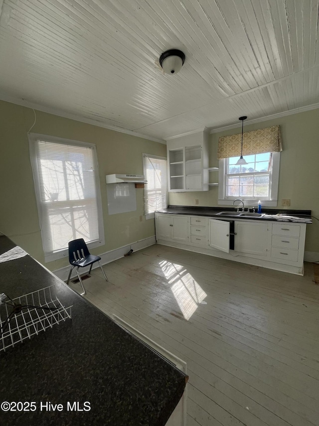 105 Hazel St, Woodland, NC 27897 - kitchen featuring dark countertops, white cabinetry, a sink, open shelves, and light wood-style floors