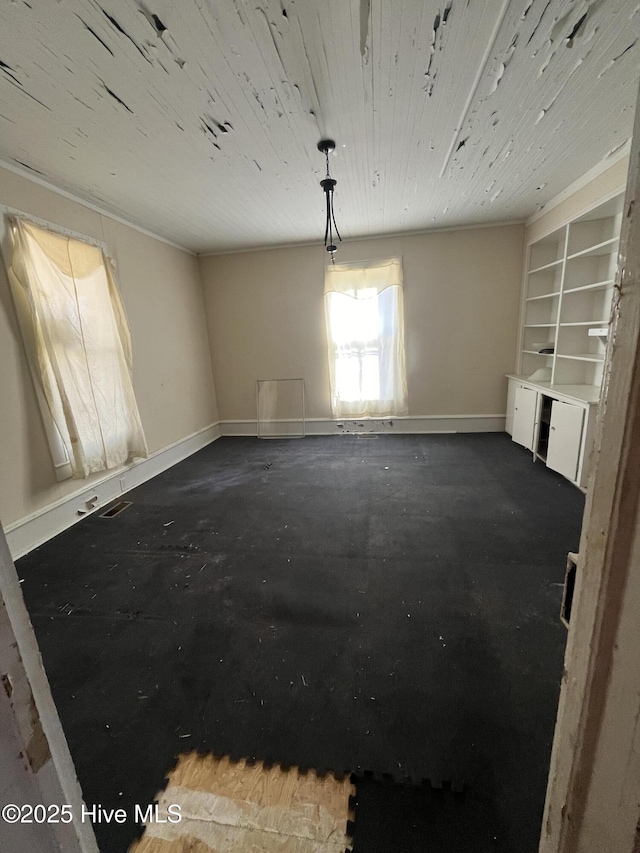105 Hazel St, Woodland, NC 27897 - unfurnished room with wooden ceiling and baseboards