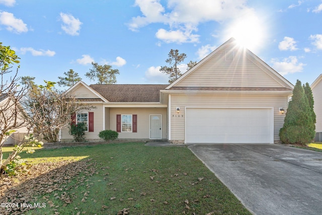 view of front of house featuring a garage and a front yard