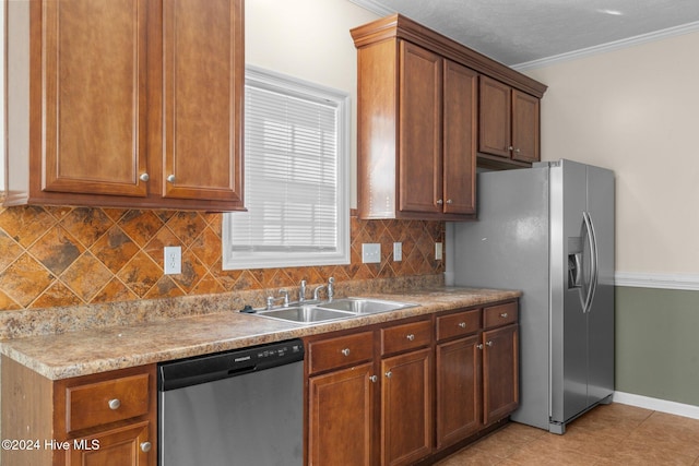 kitchen with sink, ornamental molding, appliances with stainless steel finishes, tasteful backsplash, and light tile patterned flooring