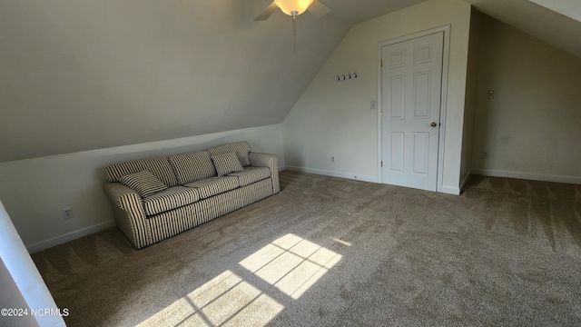 interior space with ceiling fan, carpet, and lofted ceiling