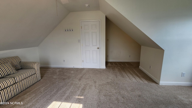 bonus room with carpet and vaulted ceiling