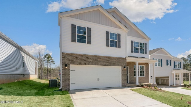 view of front of house featuring a garage, a front lawn, and cooling unit