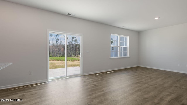 unfurnished room featuring dark hardwood / wood-style flooring