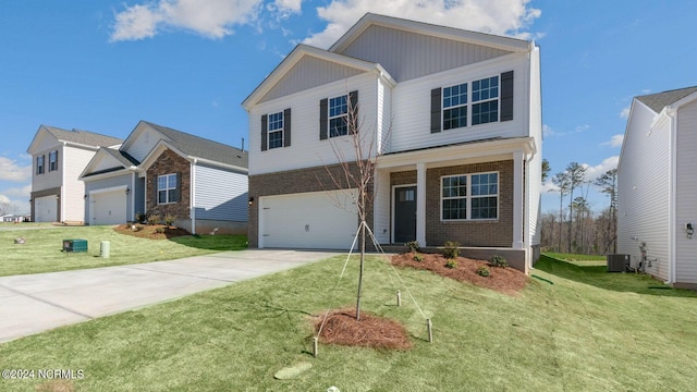 view of front of house with a front lawn and a garage