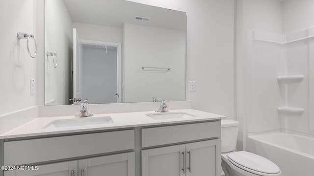 full bathroom featuring vanity, toilet, and shower / washtub combination