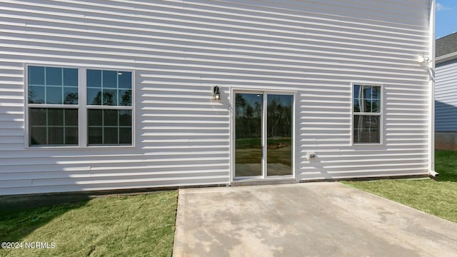 exterior space with a lawn and a patio area