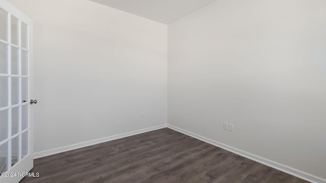 spare room featuring dark hardwood / wood-style floors