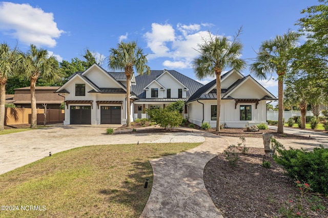 view of front facade with a garage and a front lawn