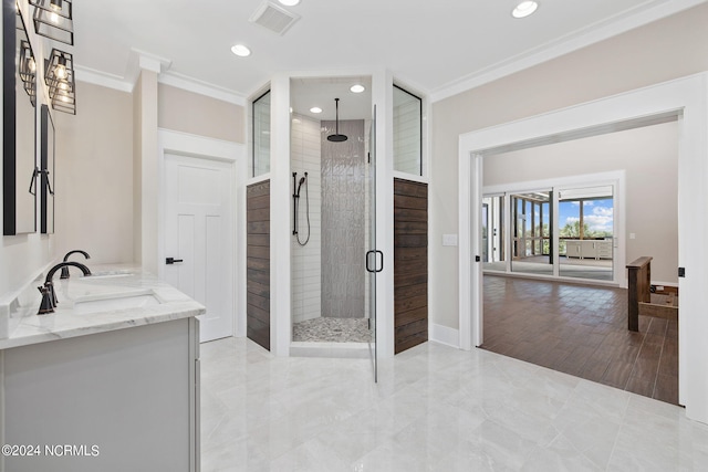 bathroom featuring vanity, walk in shower, and crown molding