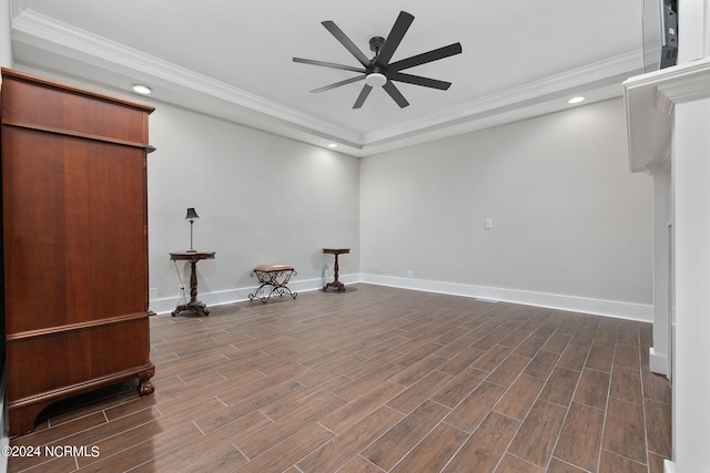 interior space featuring ceiling fan and crown molding