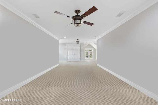 hall with ornamental molding and light carpet