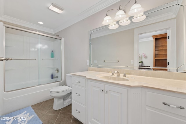 full bathroom featuring tile patterned floors, vanity, crown molding, enclosed tub / shower combo, and toilet