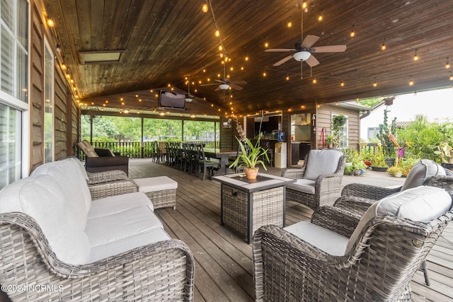 1491 Lanvale Rd NE, Leland, NC 28451 - deck with outdoor dining area, ceiling fan, and an outdoor living space