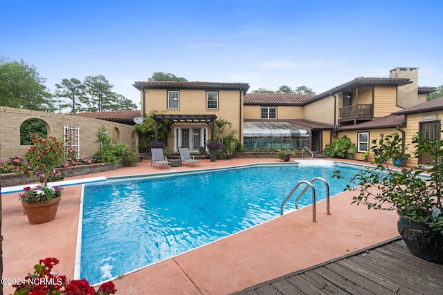 1491 Lanvale Rd NE, Leland, NC 28451 - pool with french doors and a patio area